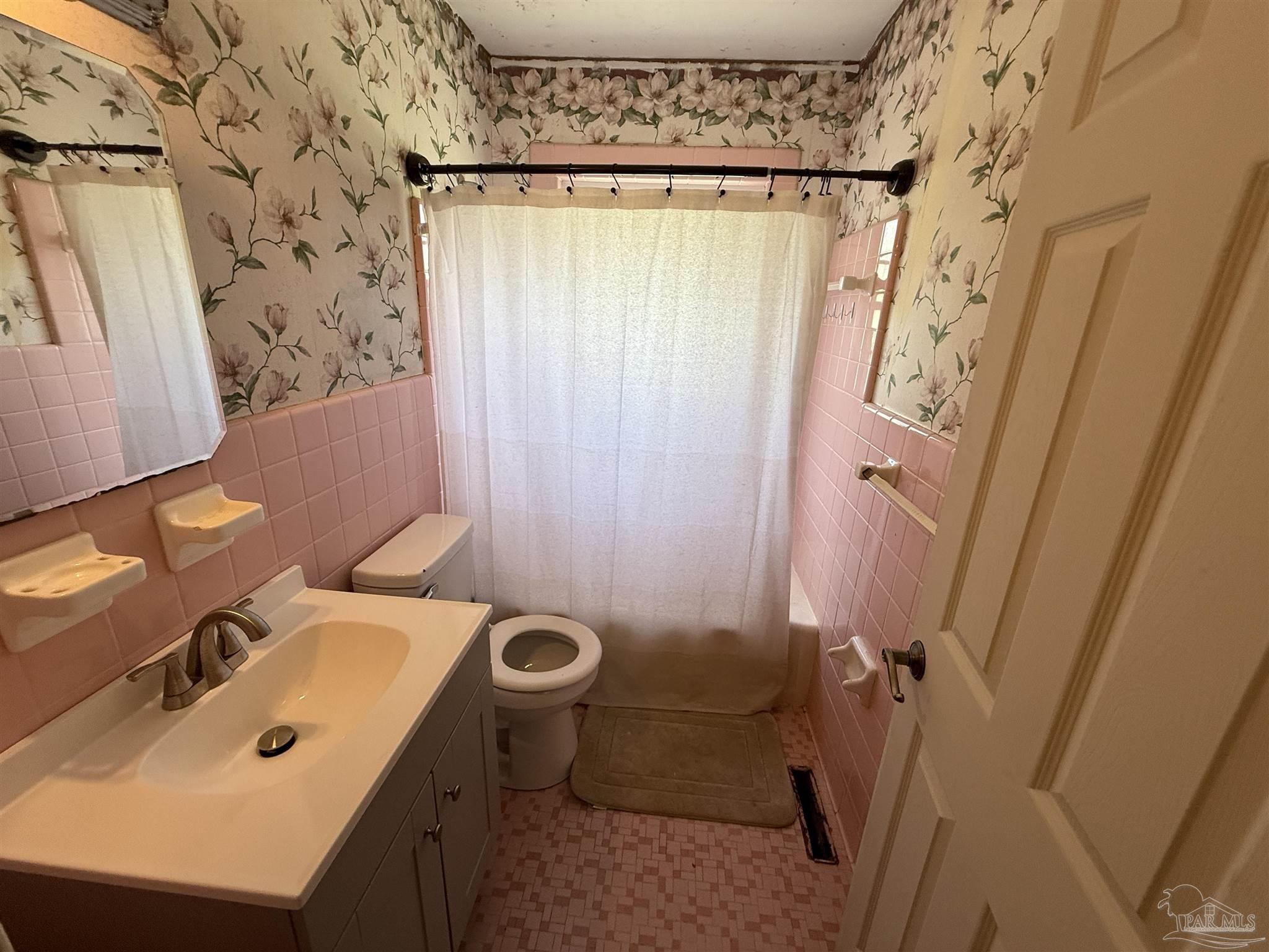 5031 Molino Road Molino, FL 32577 - Photo 16 of 37 a bathroom with a sink toilet and shower