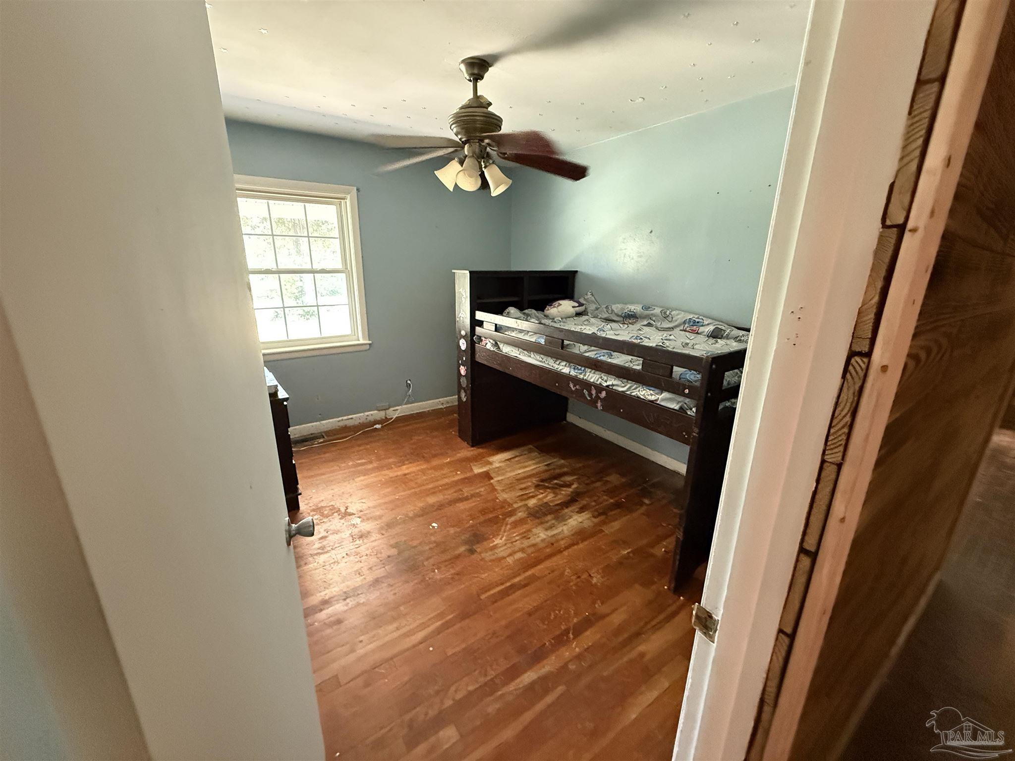 5031 Molino Road Molino, FL 32577 - Photo 18 of 37 a room with window and a wooden floor