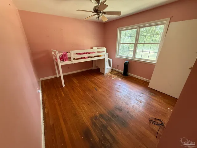 a room with furniture and large windows