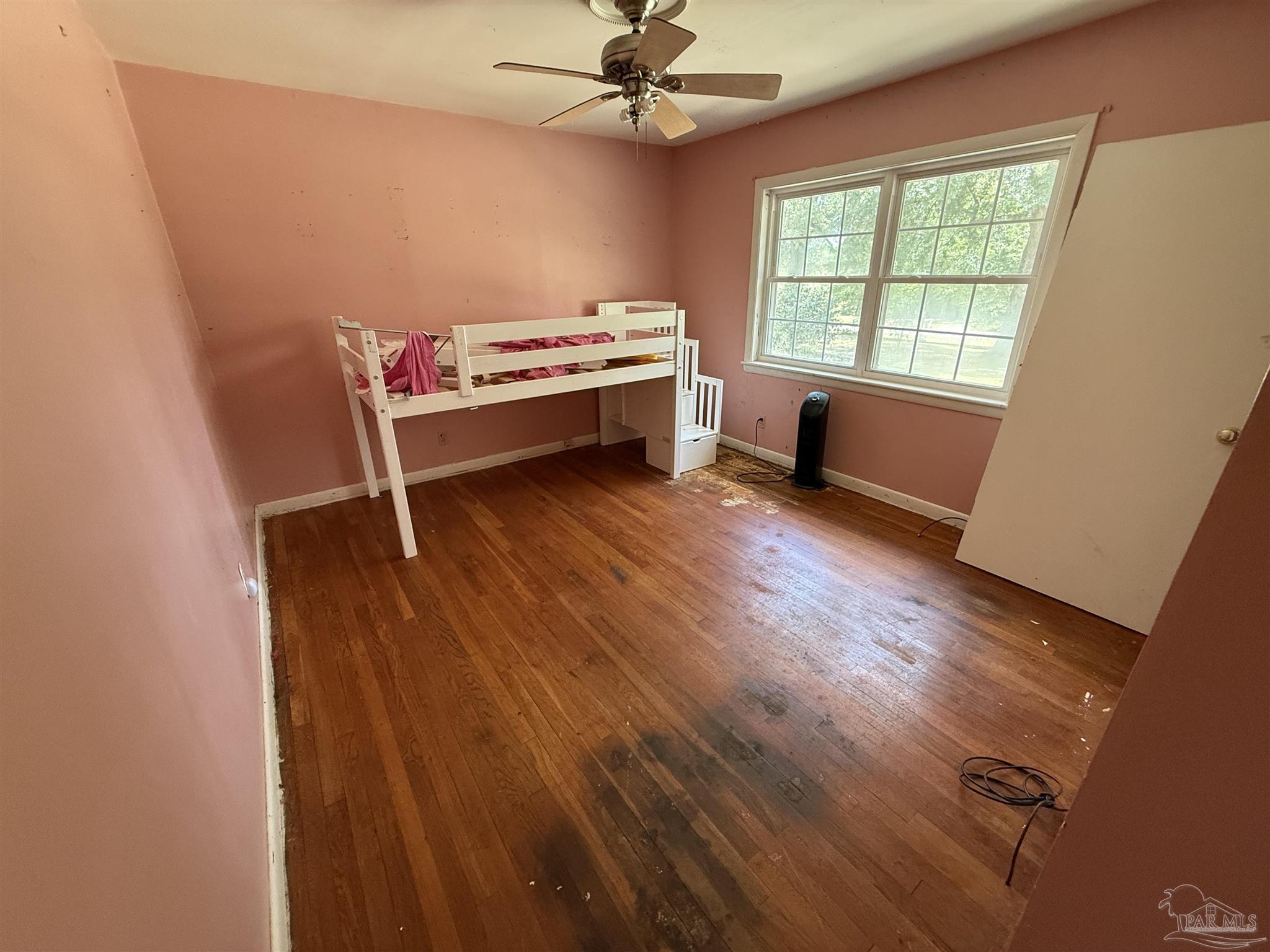 5031 Molino Road Molino, FL 32577 - Photo 19 of 37 a view of a room with wooden floor and window