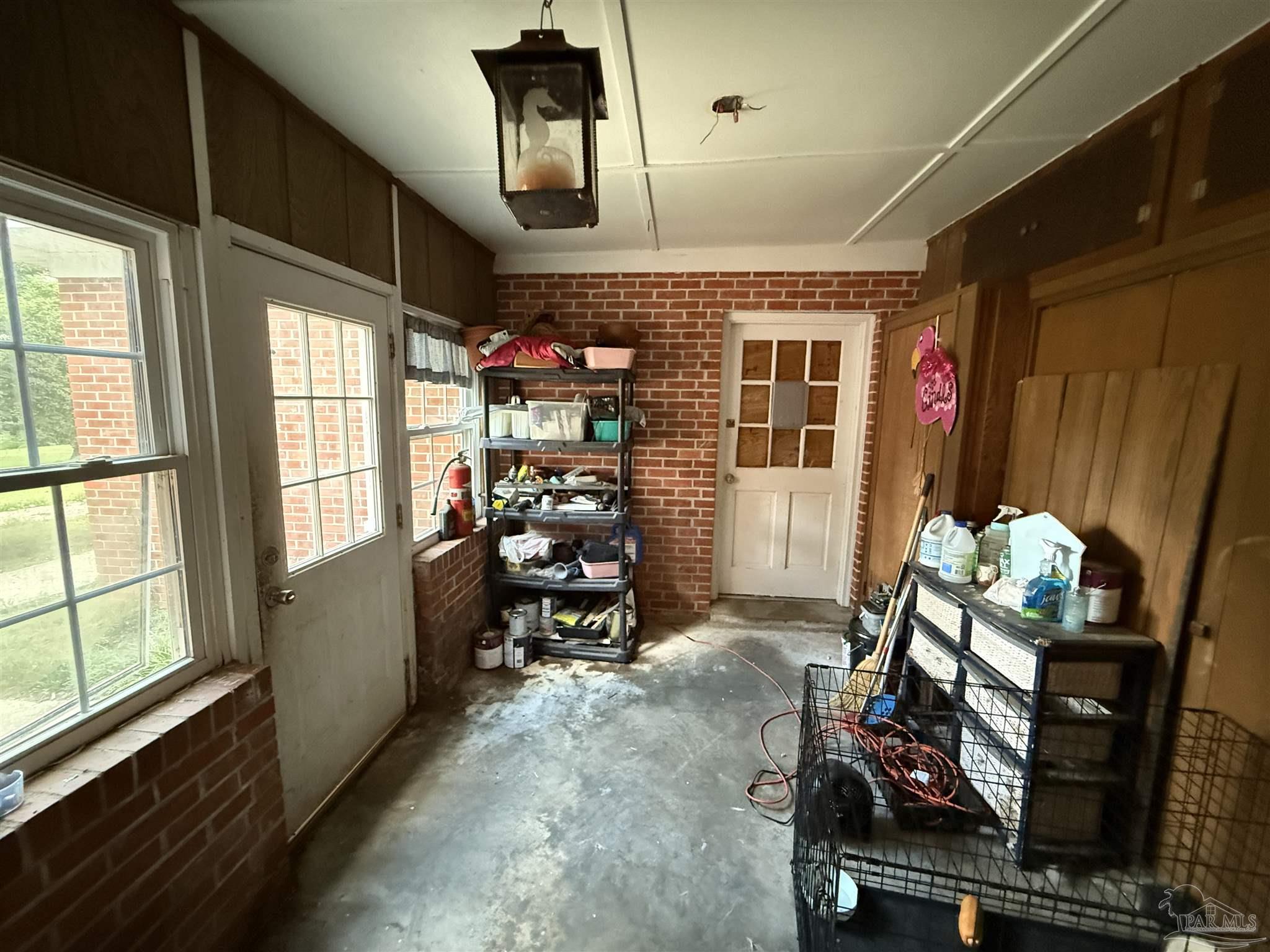 5031 Molino Road Molino, FL 32577 - Photo 20 of 37 a room with furniture and large windows