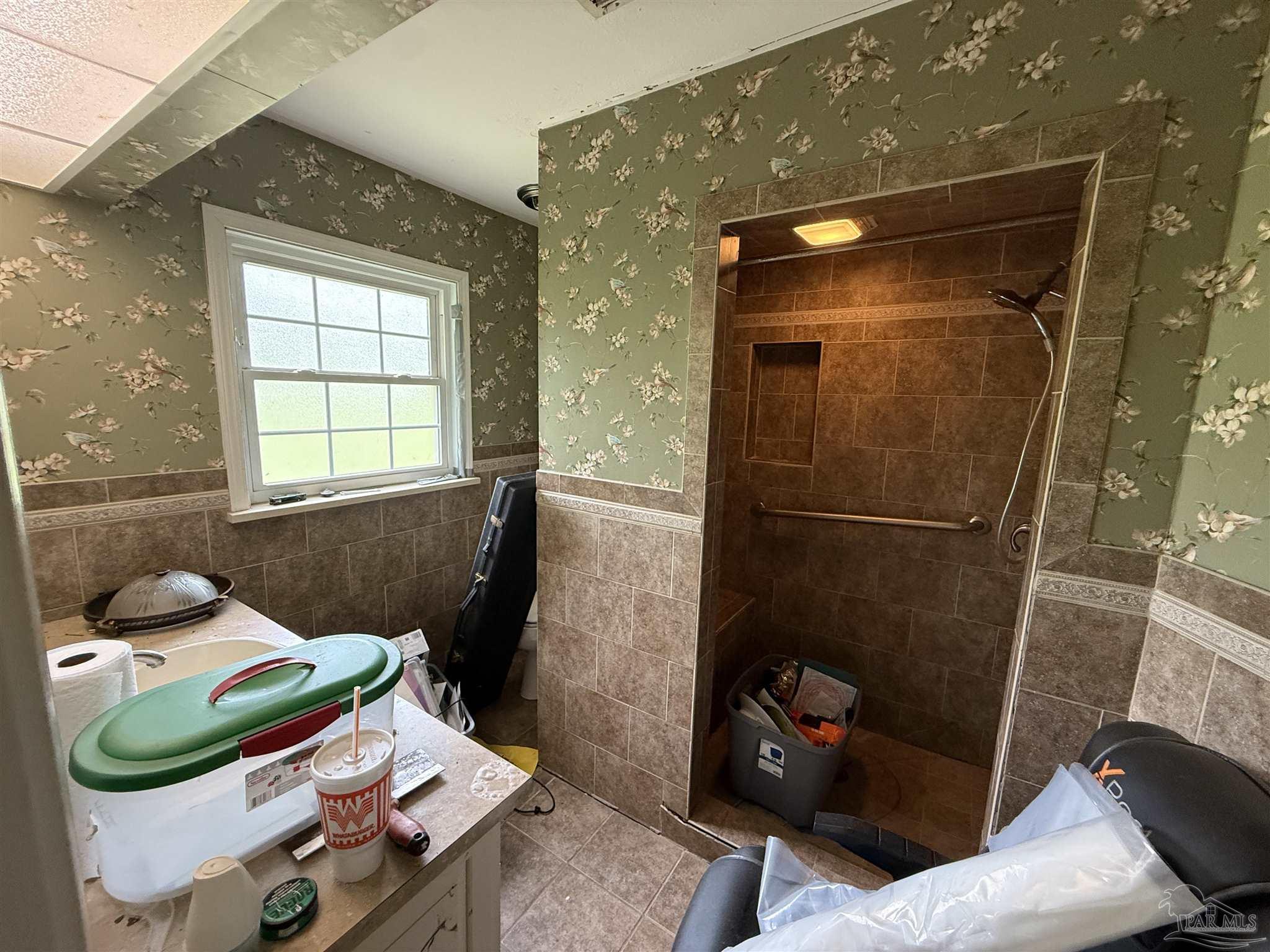 5031 Molino Road Molino, FL 32577 - Photo 25 of 37 a bathroom with a sink and a mirror