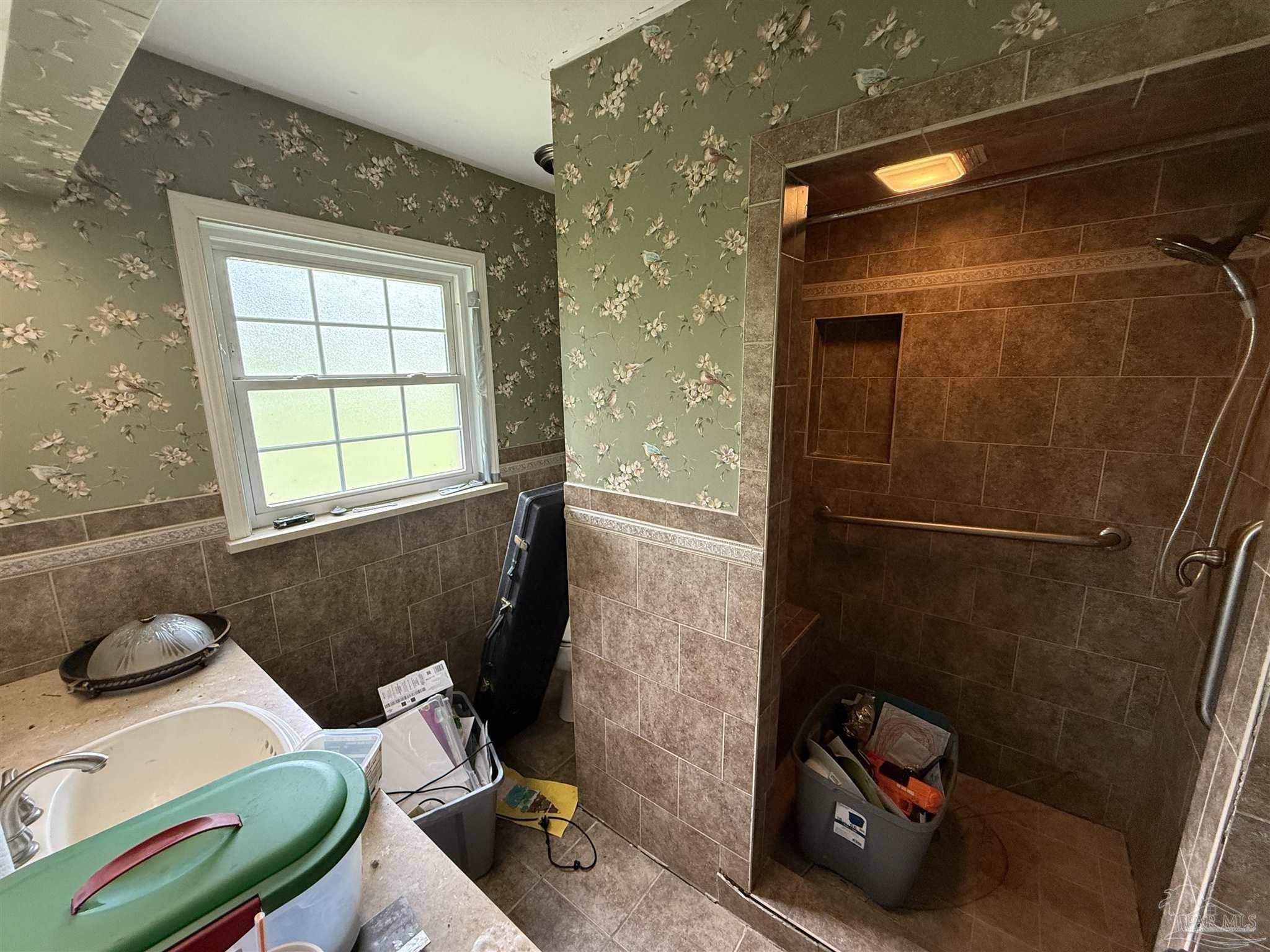 5031 Molino Road Molino, FL 32577 - Photo 26 of 37 a bathroom with a sink and a shower