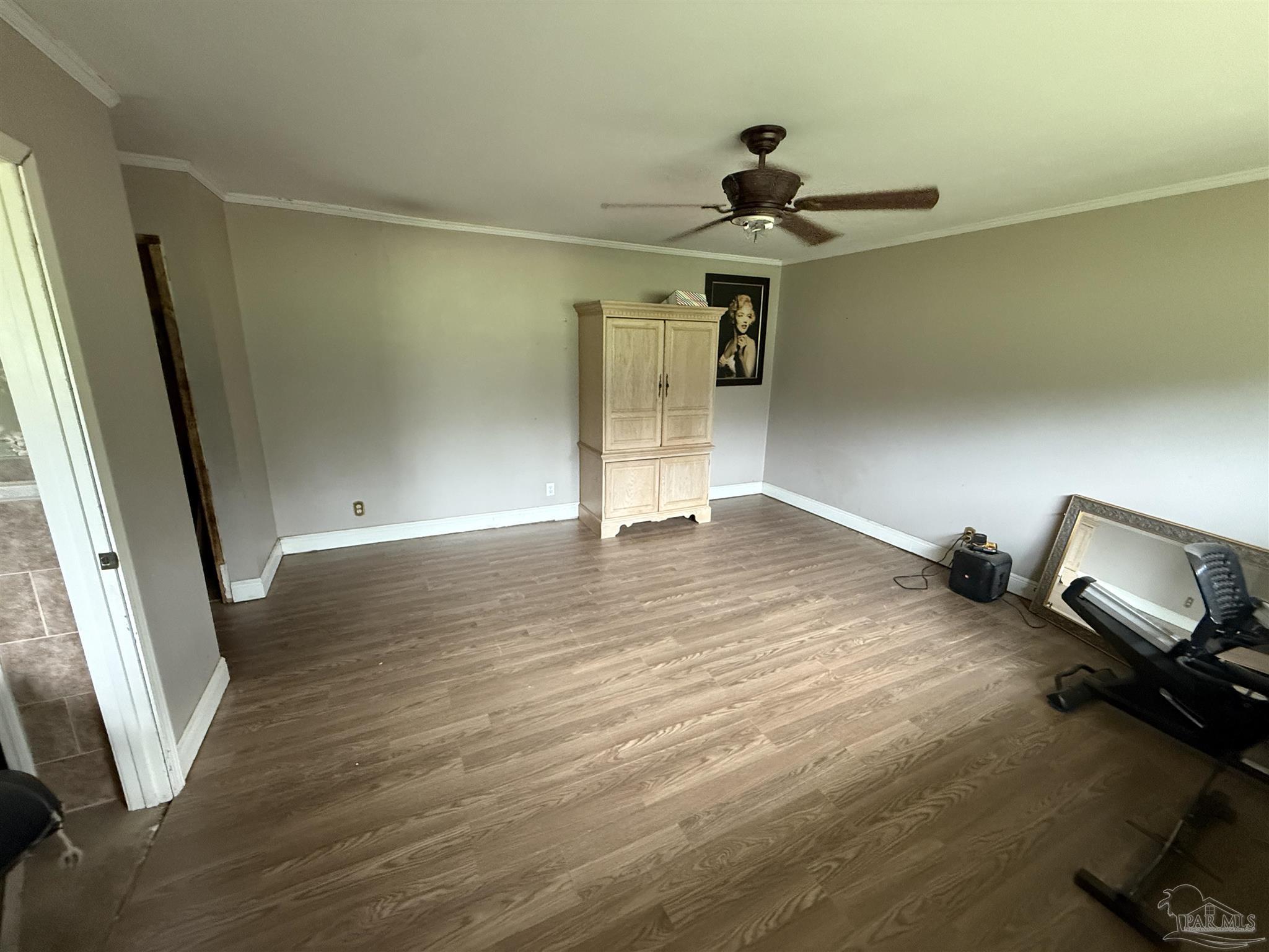 5031 Molino Road Molino, FL 32577 - Photo 27 of 37 a view of a room with wooden floor and ceiling fan