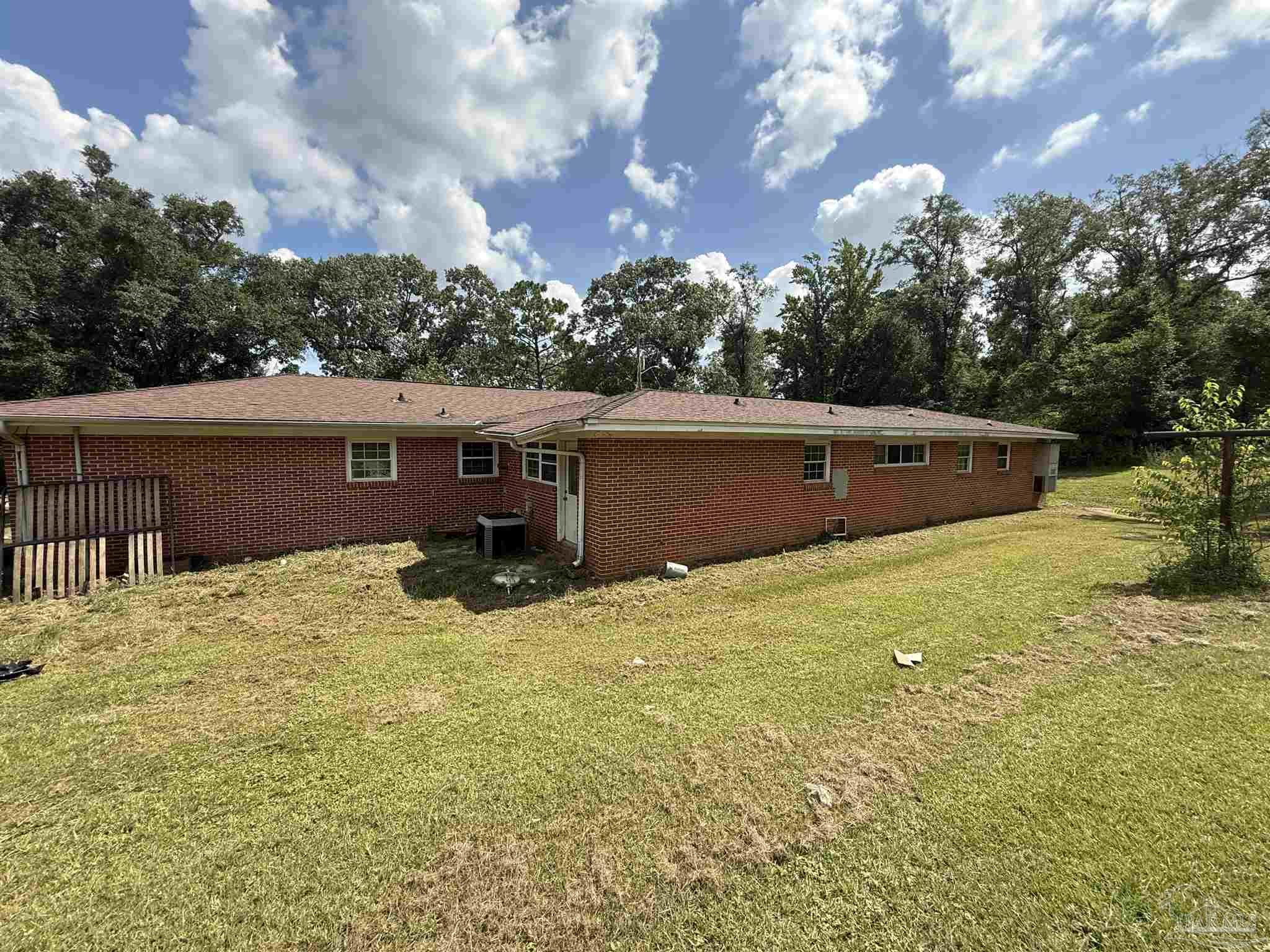 5031 Molino Road Molino, FL 32577 - Photo 31 of 37 a view of house with yard and trees in the background