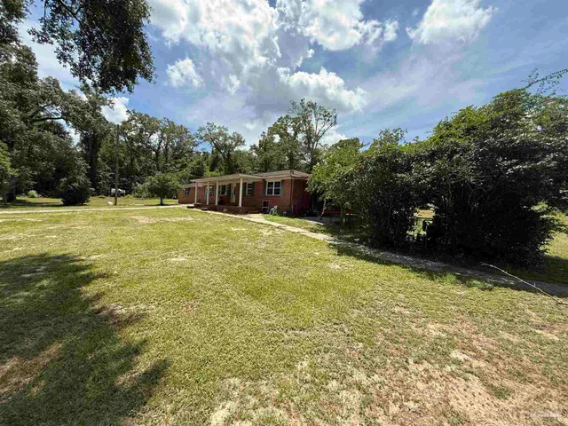 a view of a backyard with a garden