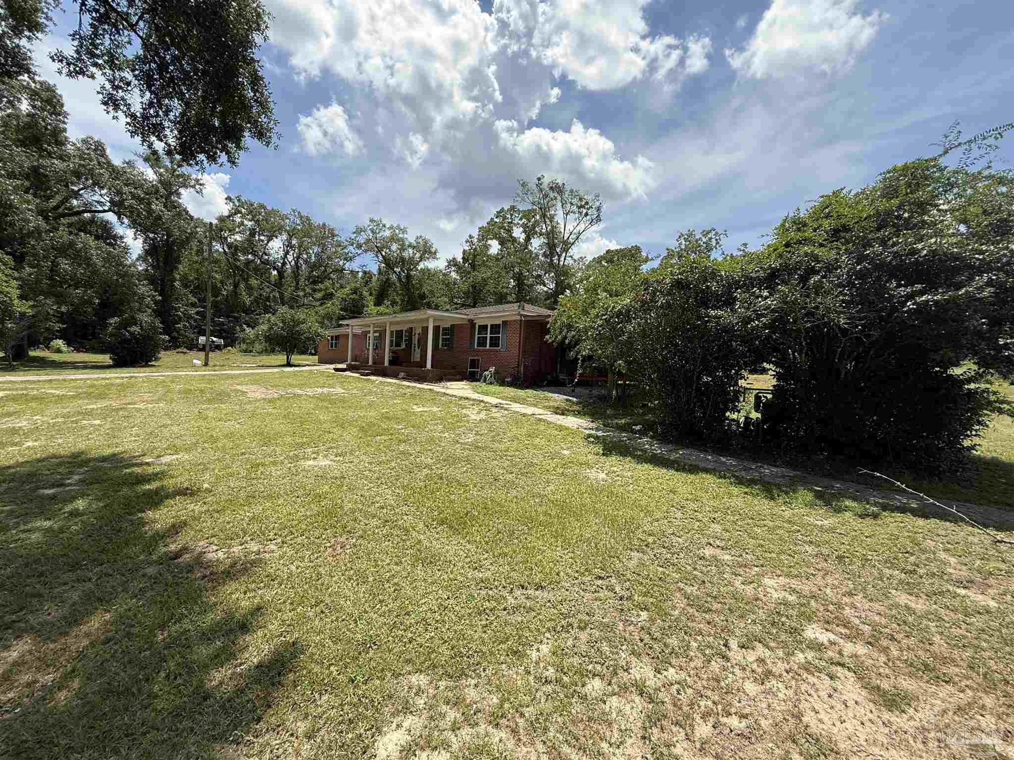 5031 Molino Road Molino, FL 32577 - Photo 33 of 37 a view of a yard with an outdoor space