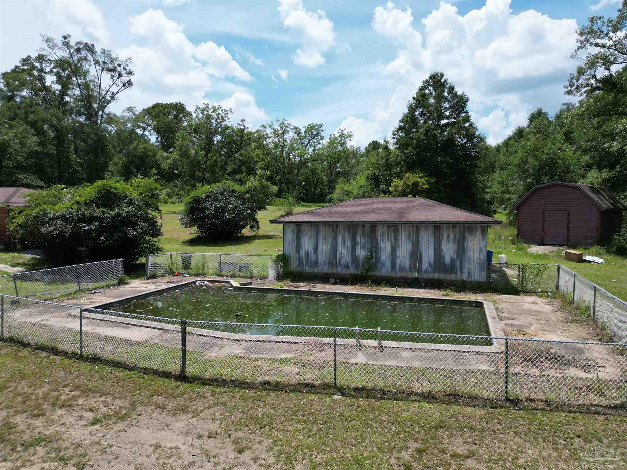 5031 Molino Road Molino, FL 32577 - Photo 34 of 37 a view of a backyard with a garden