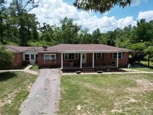 front view of a house with a yard