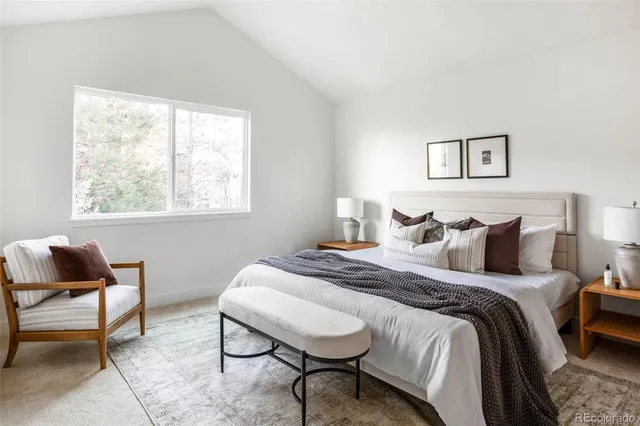 a bedroom with bed and a window