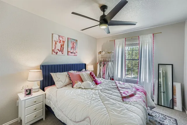 a bedroom with a bed and a large dresser