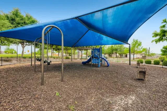 a view of a house with backyard from a patio