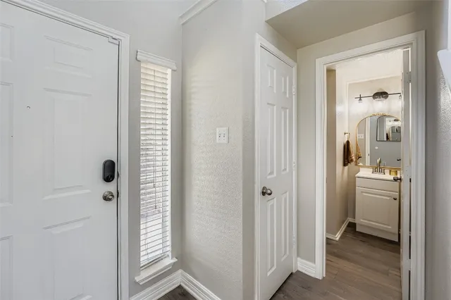 a view of a bathroom from the hallway