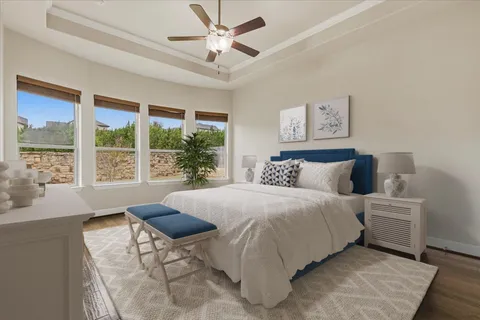 a bedroom with a large bed and a large window