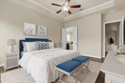 a bedroom with a bed and a view of bathroom