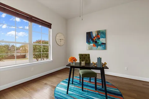 a living room with furniture and a rug