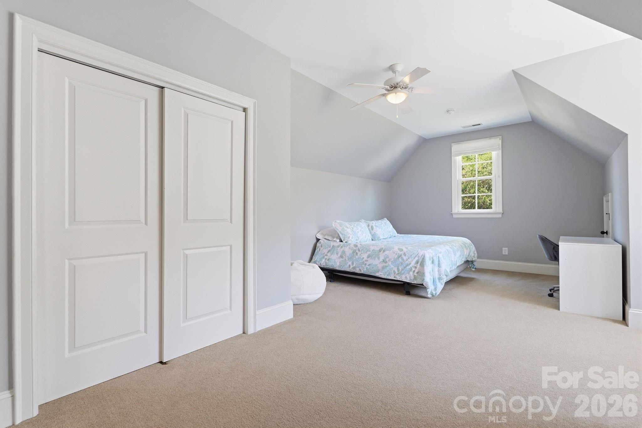 235 Grey Road Davidson, NC 28036 - Photo 24 of 42 a bedroom with a bed and a night stand