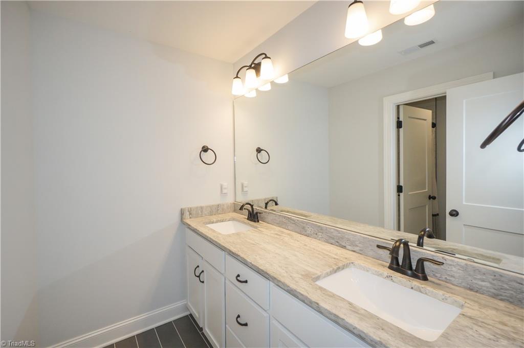 725 Sardis Church Road Madison, NC 27025 - Photo 17 of 21 second floor bathroom with dual sinks