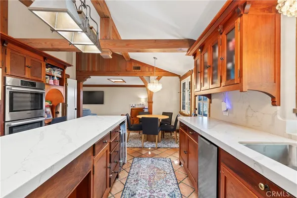 a view of a kitchen with a sink and cabinets