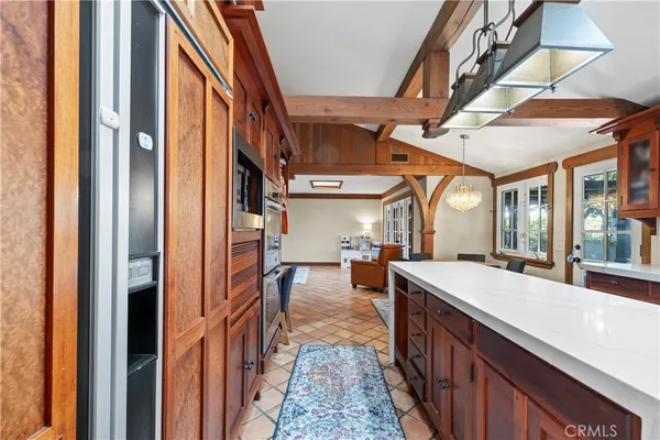 a very nice looking room with a large window and chandelier