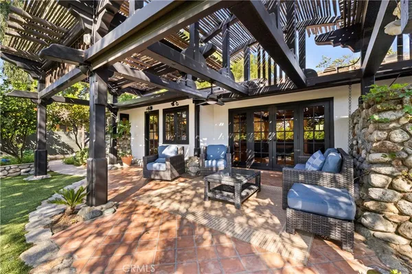 a building outdoor space with patio furniture and garden