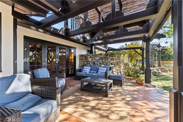 a outdoor living space with patio furniture and a potted plant