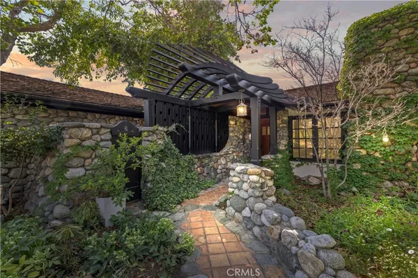 a view of a pathway with a tree