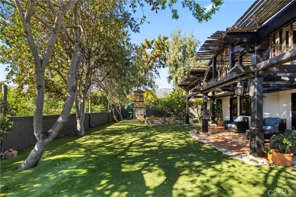 a view of a park with large trees