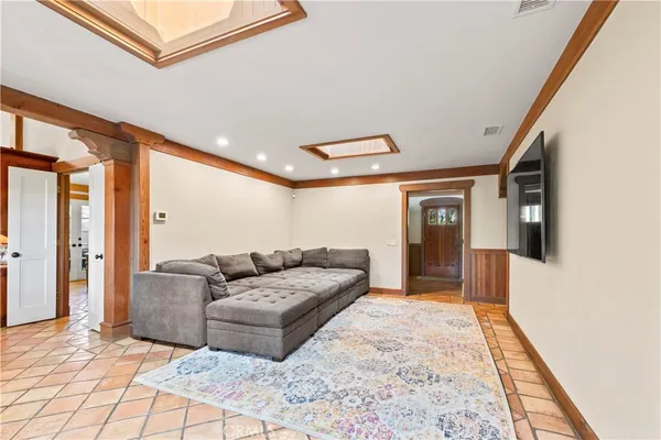 a living room with furniture and a rug