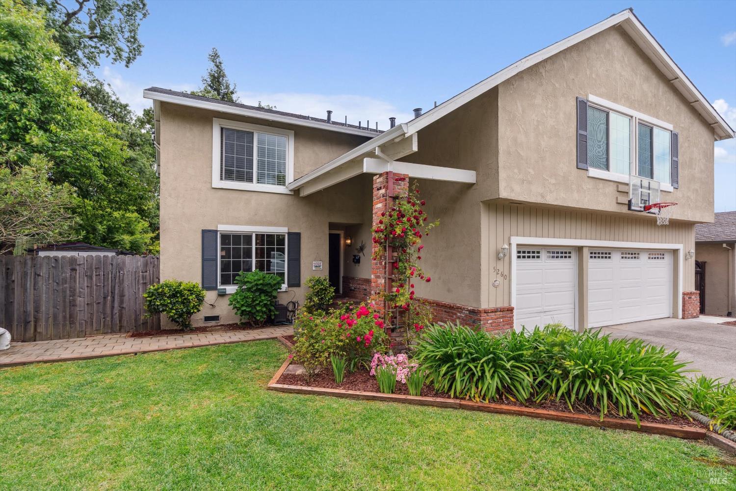 5260 San Luis Avenue Santa Rosa, CA 95409 - Photo 1 of 1 a front view of a house with a garden and plants