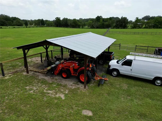 a view of a golf course with chairs