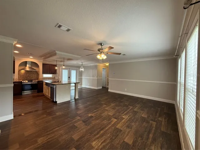 a open kitchen with a table and chairs