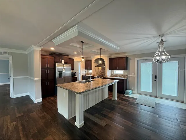 a kitchen with a table and chairs in it