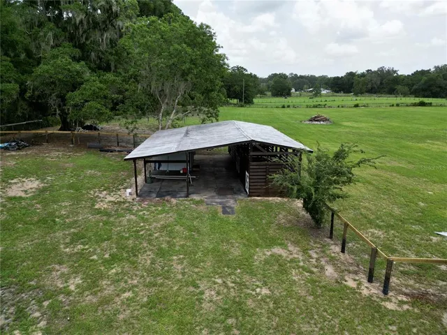 a view of a backyard with a car park