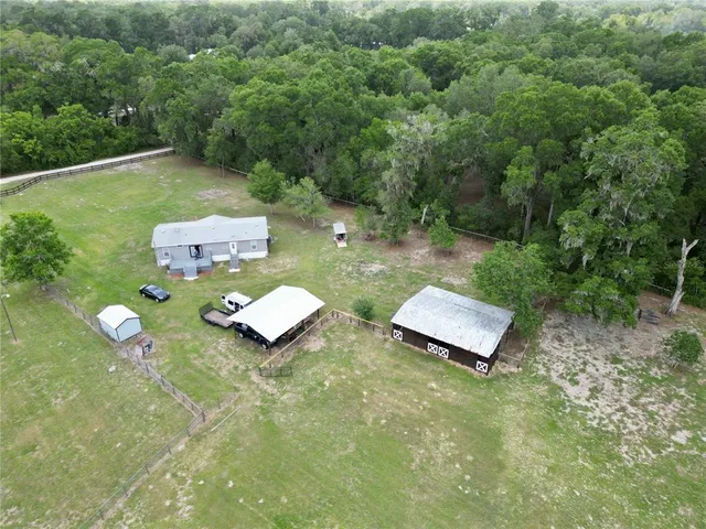 a wooden fence with some plants