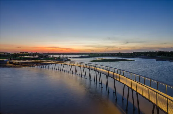 a view of a swimming pool with outdoor seating