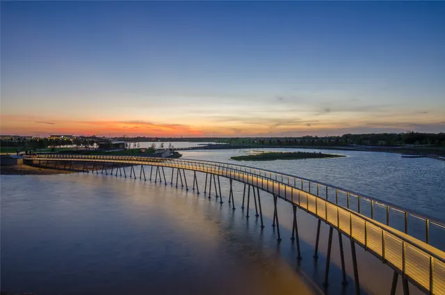 a view of a swimming pool with outdoor seating