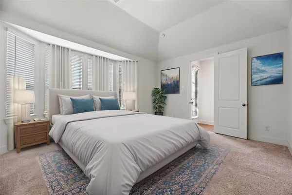 a kitchen with white cabinets and a stove with wooden floor