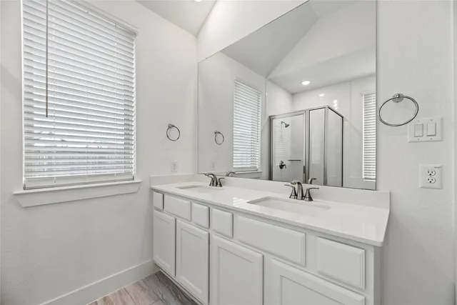 a kitchen with kitchen island a sink stainless steel appliances and cabinets
