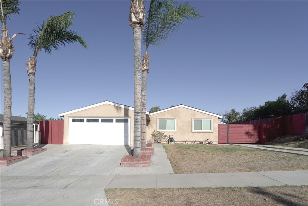 a front view of a house with a garage and window