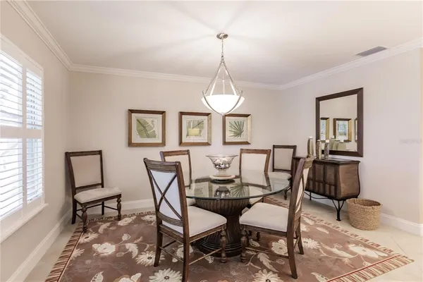a dining room with furniture and window