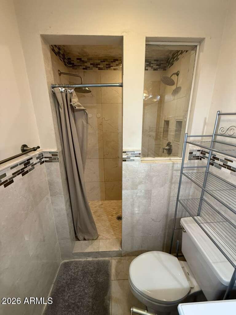 3110 East 13th Street Douglas, AZ 85607 - Photo 19 of 42 a bathroom with a toilet and a shower