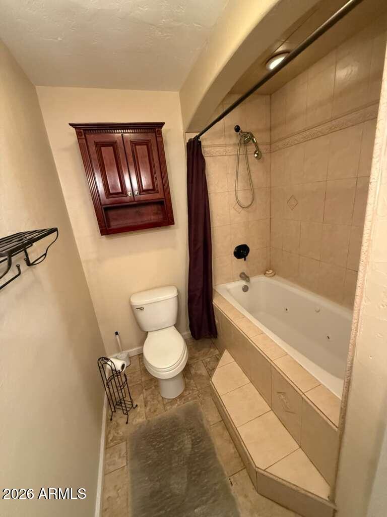 3110 East 13th Street Douglas, AZ 85607 - Photo 28 of 42 a bathroom with a toilet and a shower