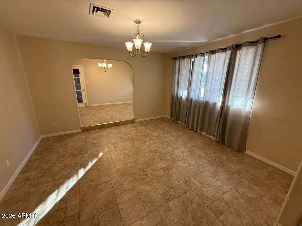 3110 East 13th Street Douglas, AZ 85607 - Photo 38 of 42 an empty room with stairs and wooden floor