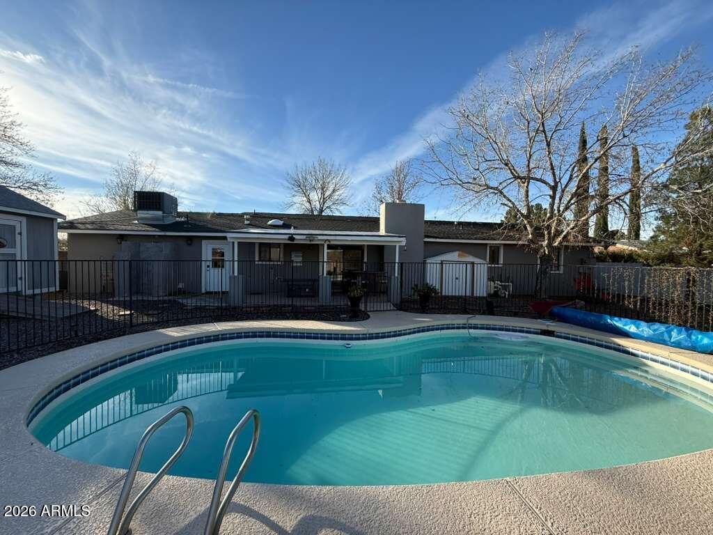 3110 East 13th Street Douglas, AZ 85607 - Photo 39 of 42 a view of a house with swimming pool and sitting area