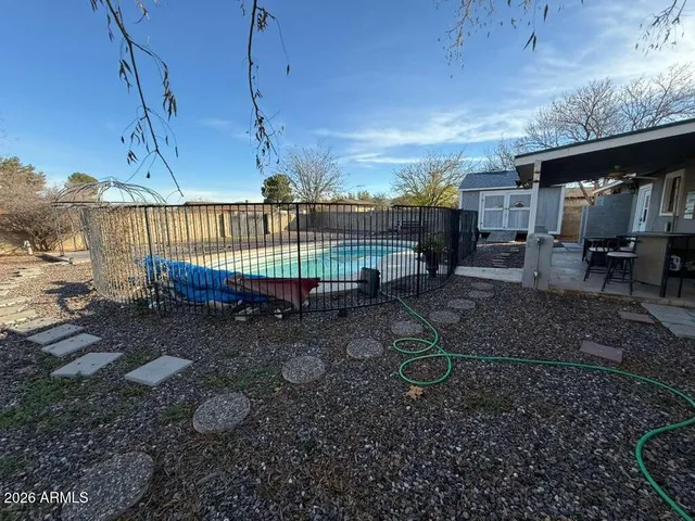 a view of a back yard of the house