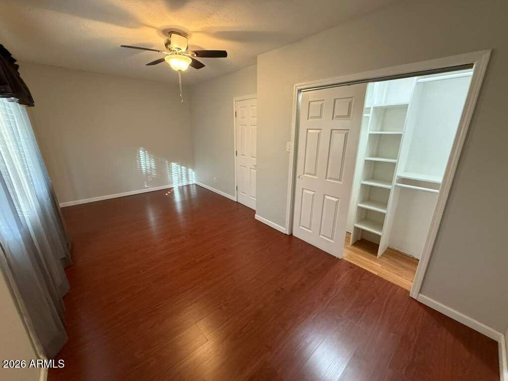 3110 East 13th Street Douglas, AZ 85607 - Photo 9 of 42 wooden floor in an empty room with a window