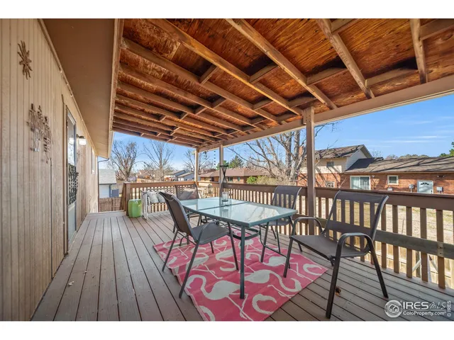 a view of a chairs and table on the deck