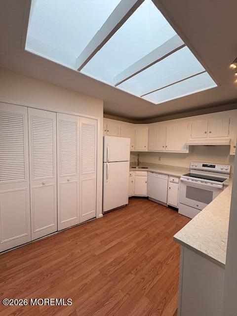 15 Lexington Court Red Bank, NJ 07701 - Photo 18 of 21 a kitchen with white cabinets and white appliances