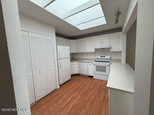 15 Lexington Court Red Bank, NJ 07701 - Photo 21 of 21 a kitchen with white cabinets and white appliances